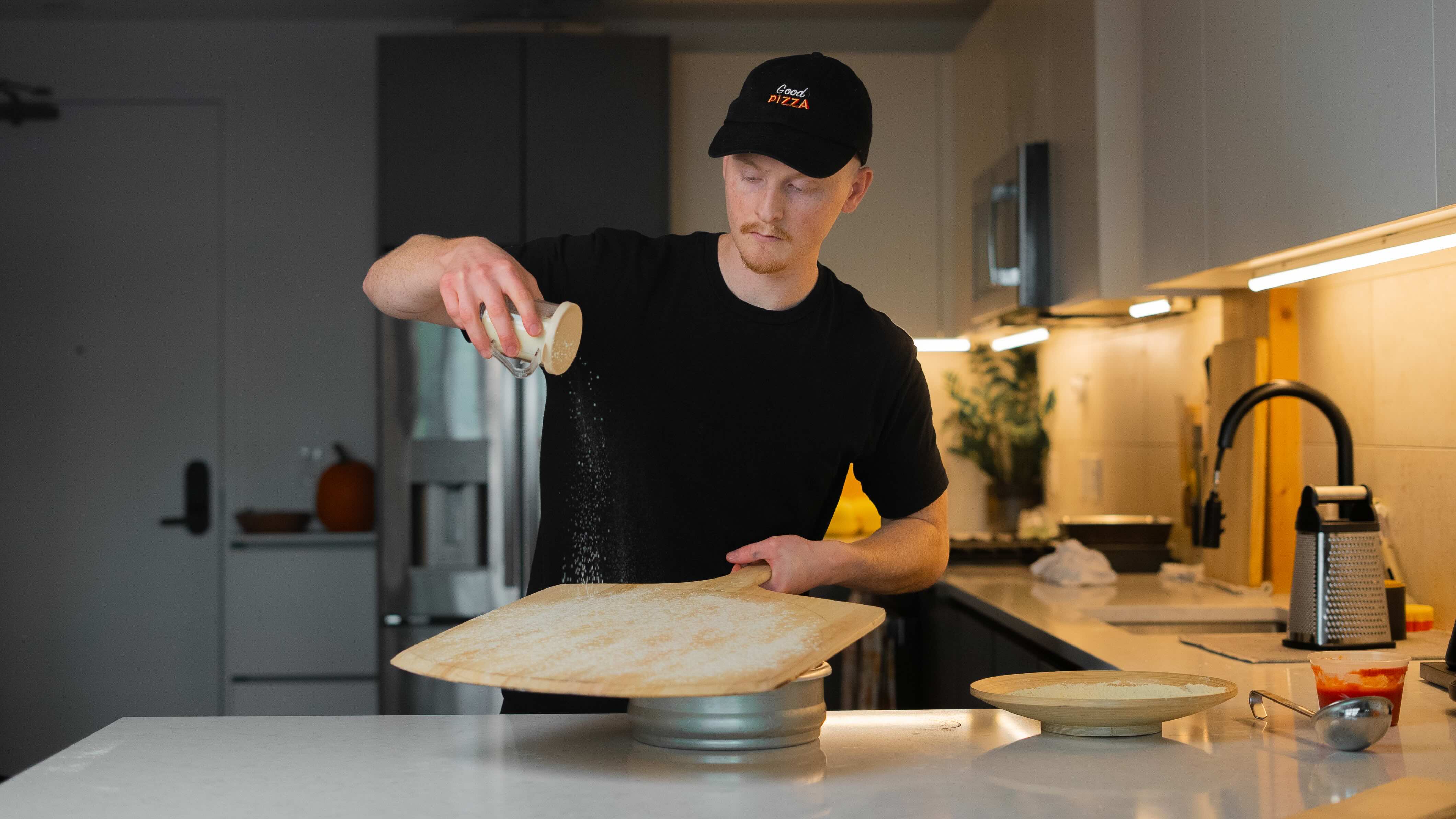 Flouring the pizza peel